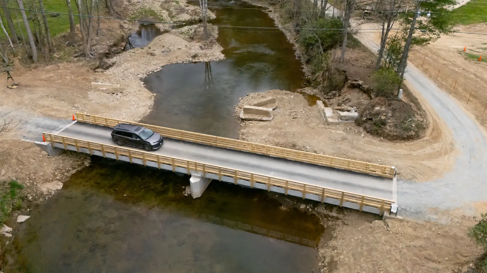 Aerial view of a private bridge replacement over the Watauga River in Valle Crucis, NC